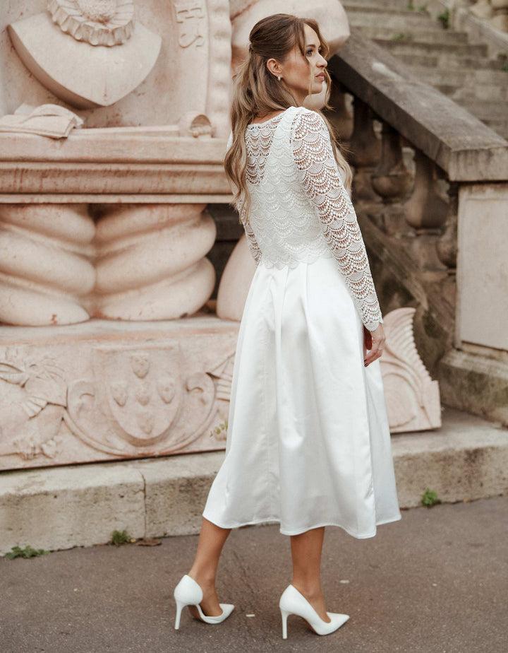 andcompliments_online_shop_brautmode_tulle_skirt_tuellrock_tuell_braut_hochzeit_online_shoppen_crop_top_langarm_spitze_oberteil_braut_bogen_wellen-_brautkleid_alternative